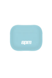 The 6PM AIRPODS CASE TURQUOISE is a light blue rectangular case with rounded edges and 6PM printed in white on the front, designed to keep your earbuds clean and protected.